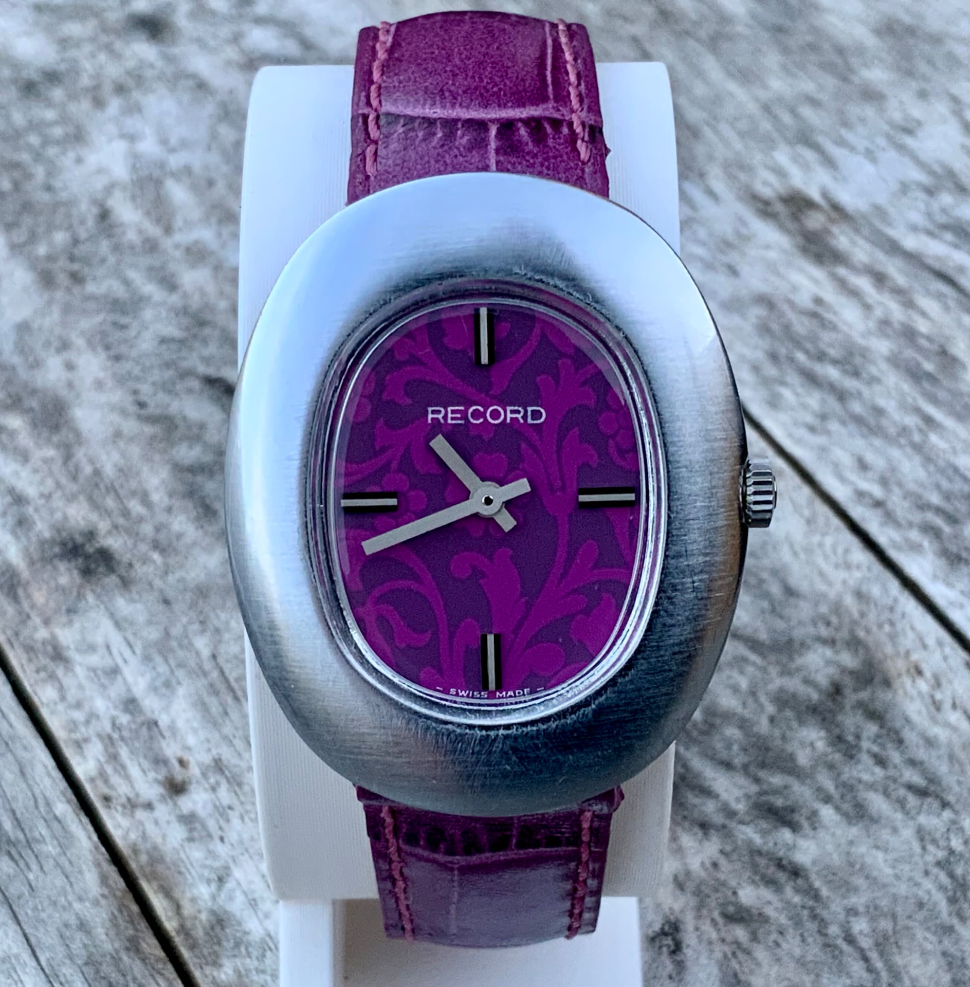 Record Geneve oval steel watch with purple patterned dial on purple leather strap