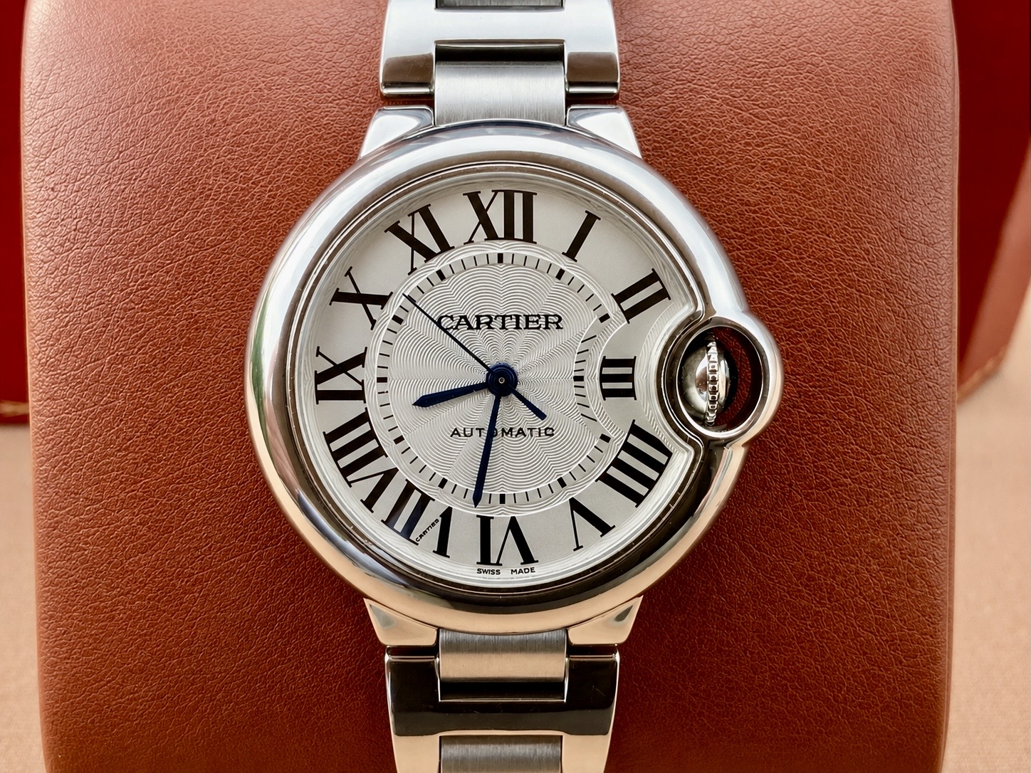 Cartier Ballon Bleu, frontal view of the silvered guilloché dial and stainless-steel bracelet