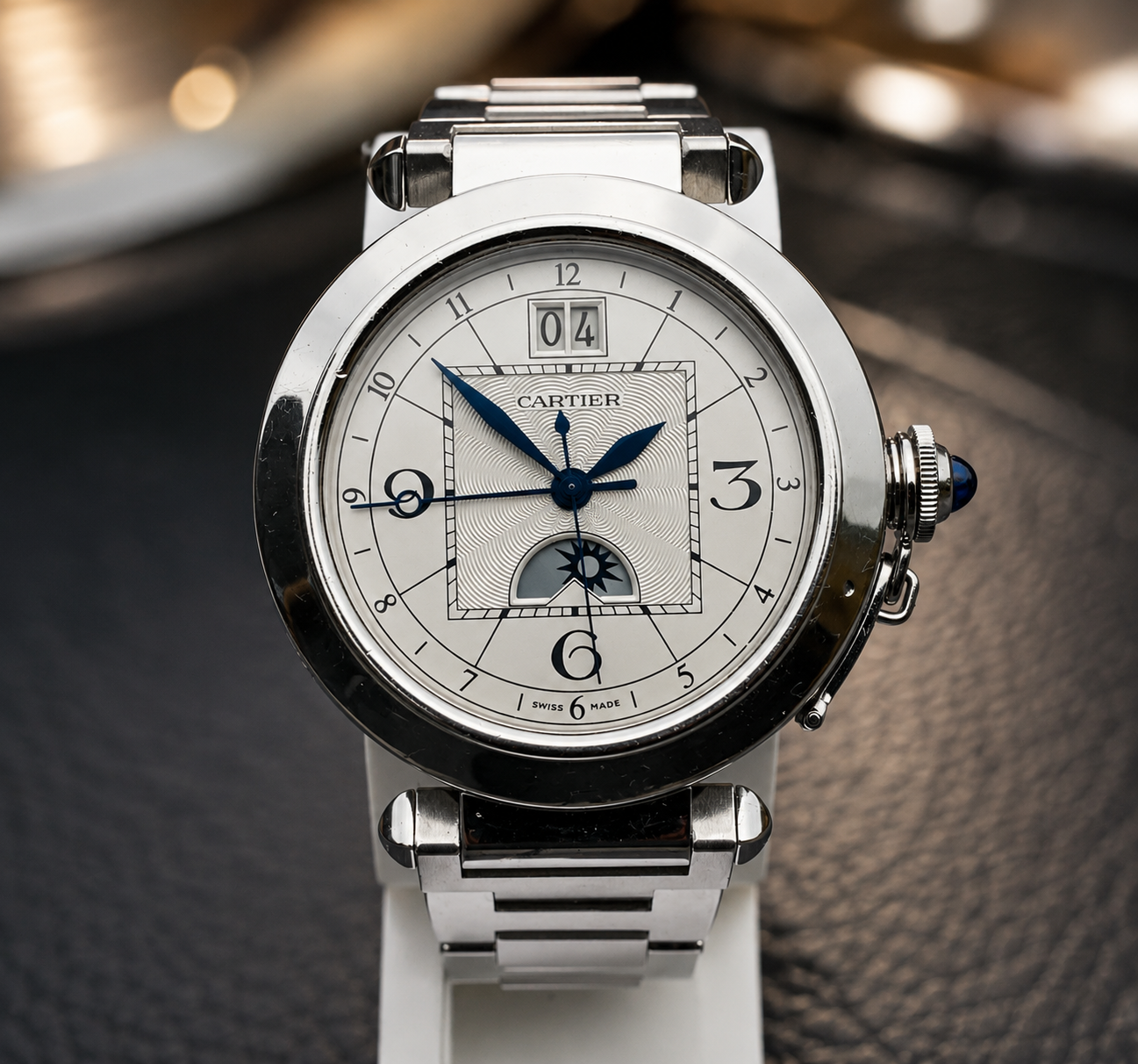 Cartier Pasha Day & Night GMT, frontal view on wooden surface