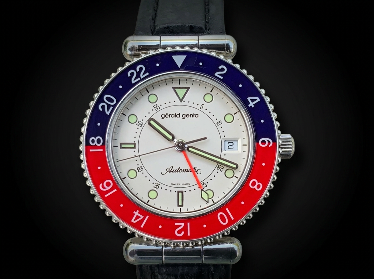 Gérald Genta GMT Automatic Ref. G3252.4 with red and blue Pepsi bezel and black leather strap.
