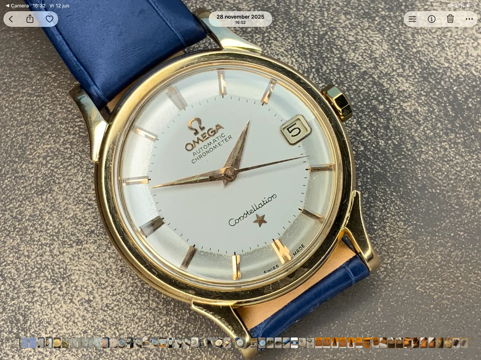 Omega Constellation automatic chronometer in gold on blue leather strap